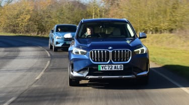 Volvo C40 following BMW iX1 - front